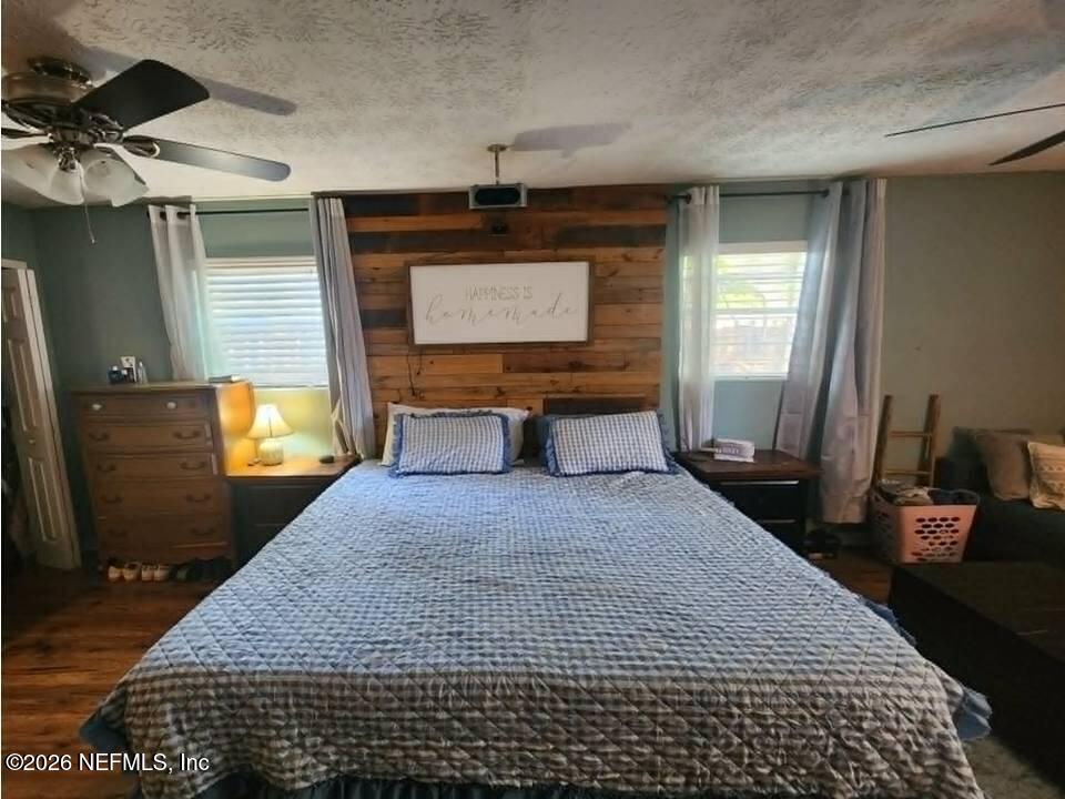8302 Cassie Road Jacksonville, FL 32221 - Photo 23 of 46 a bedroom with a bed and a mirror