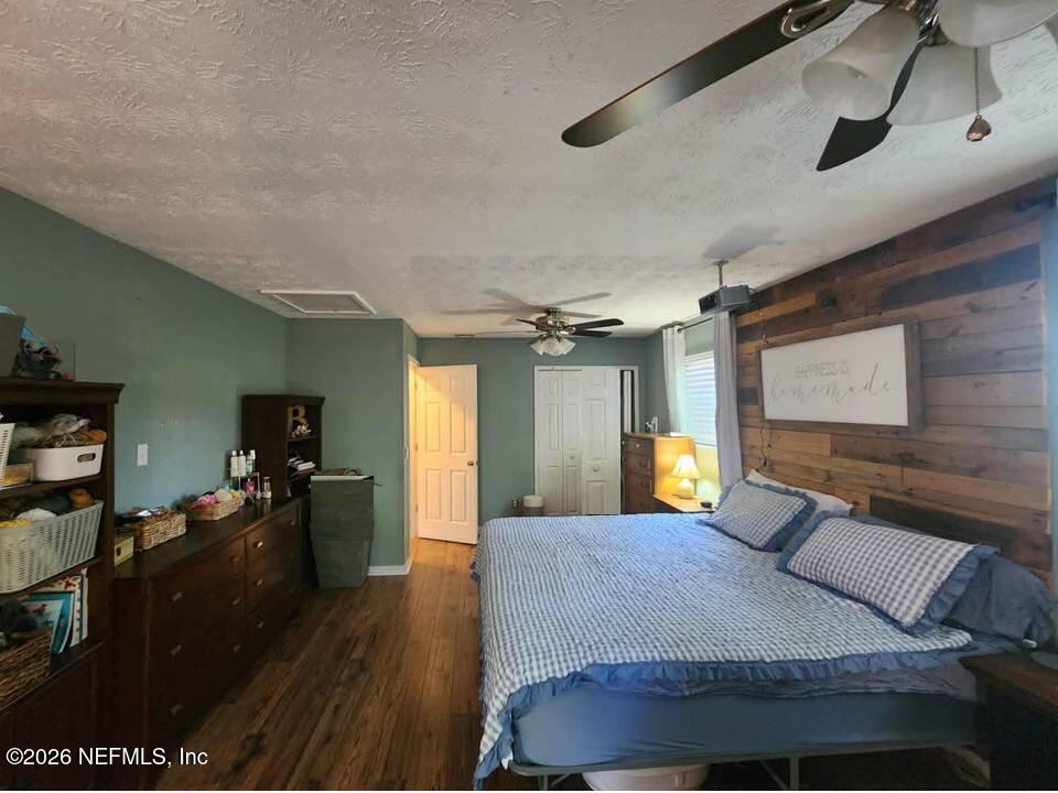 8302 Cassie Road Jacksonville, FL 32221 - Photo 24 of 46 a bed room with a bed and a television
