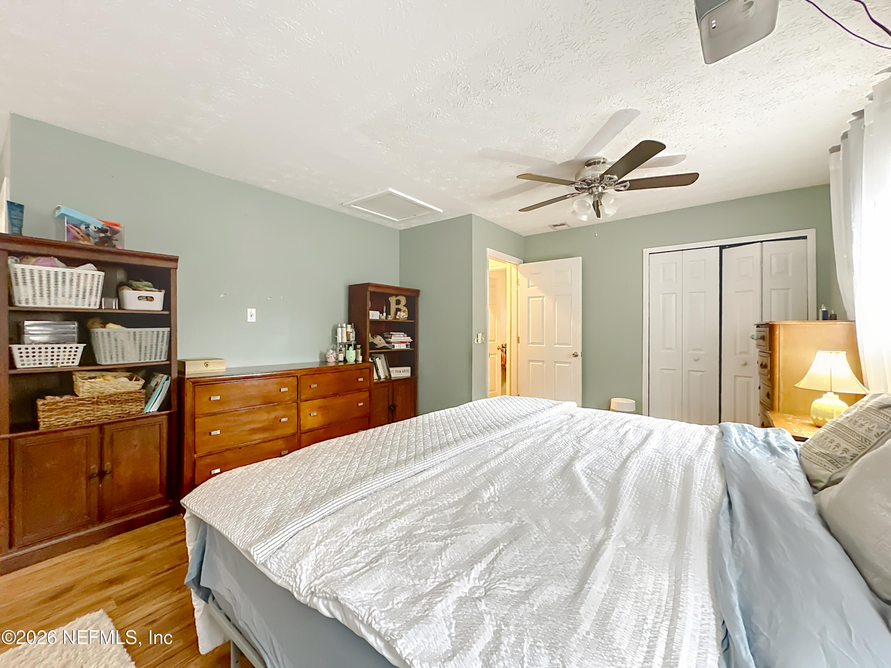 8302 Cassie Road Jacksonville, FL 32221 - Photo 28 of 48 a bed room with a bed and furniture