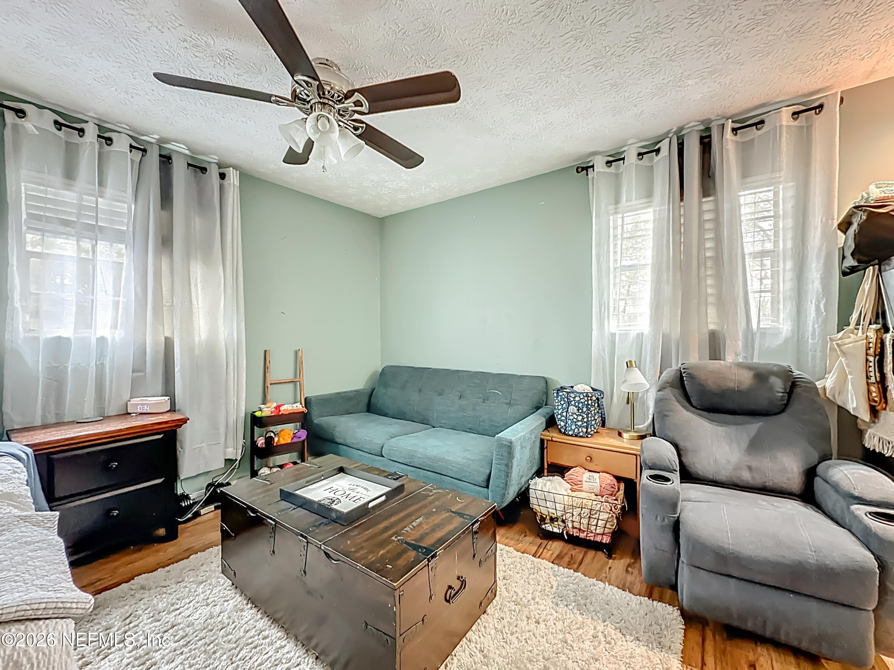8302 Cassie Road Jacksonville, FL 32221 - Photo 29 of 48 a living room with furniture and a window