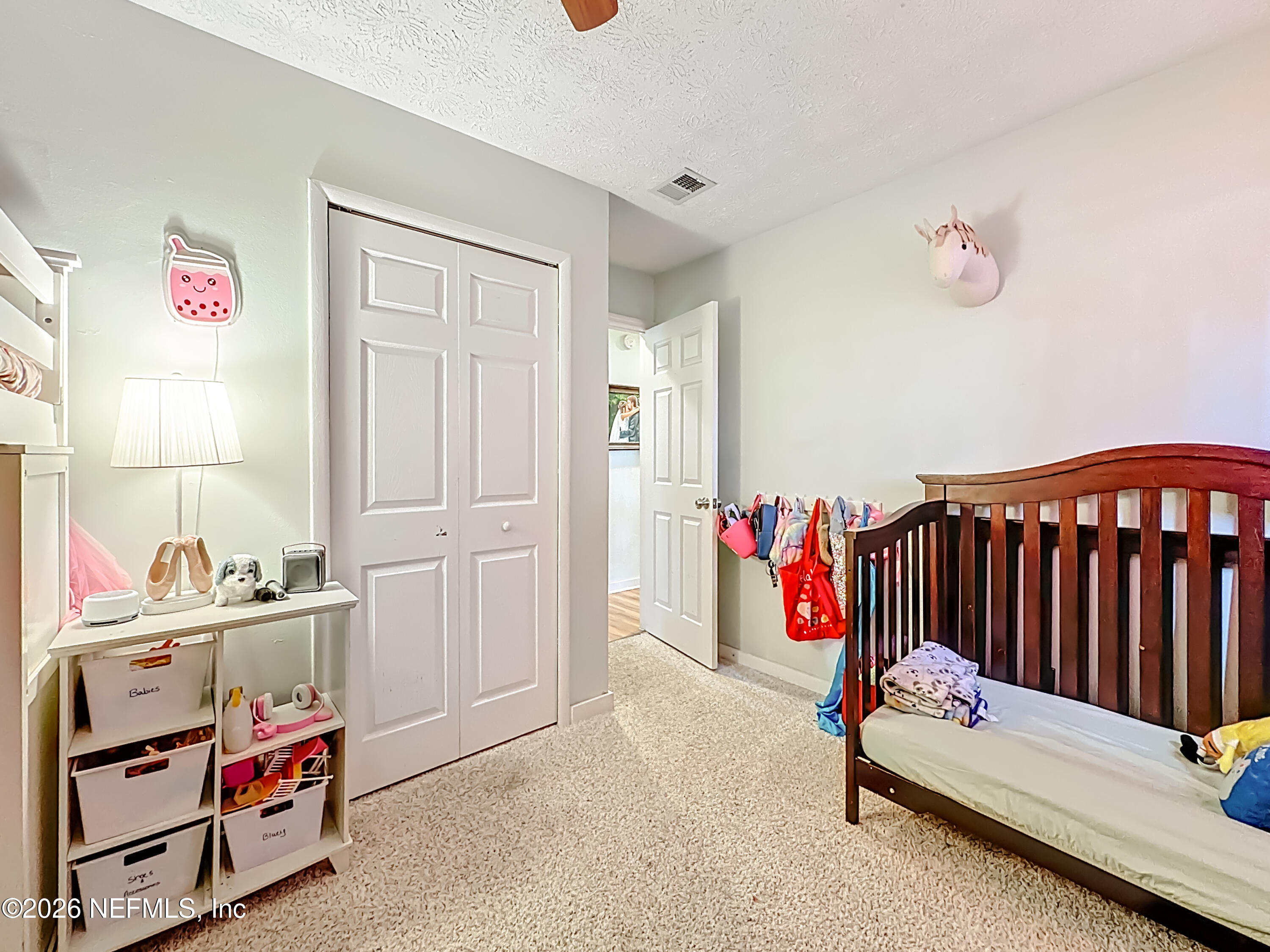 8302 Cassie Road Jacksonville, FL 32221 - Photo 36 of 48 a bedroom with furniture and a window