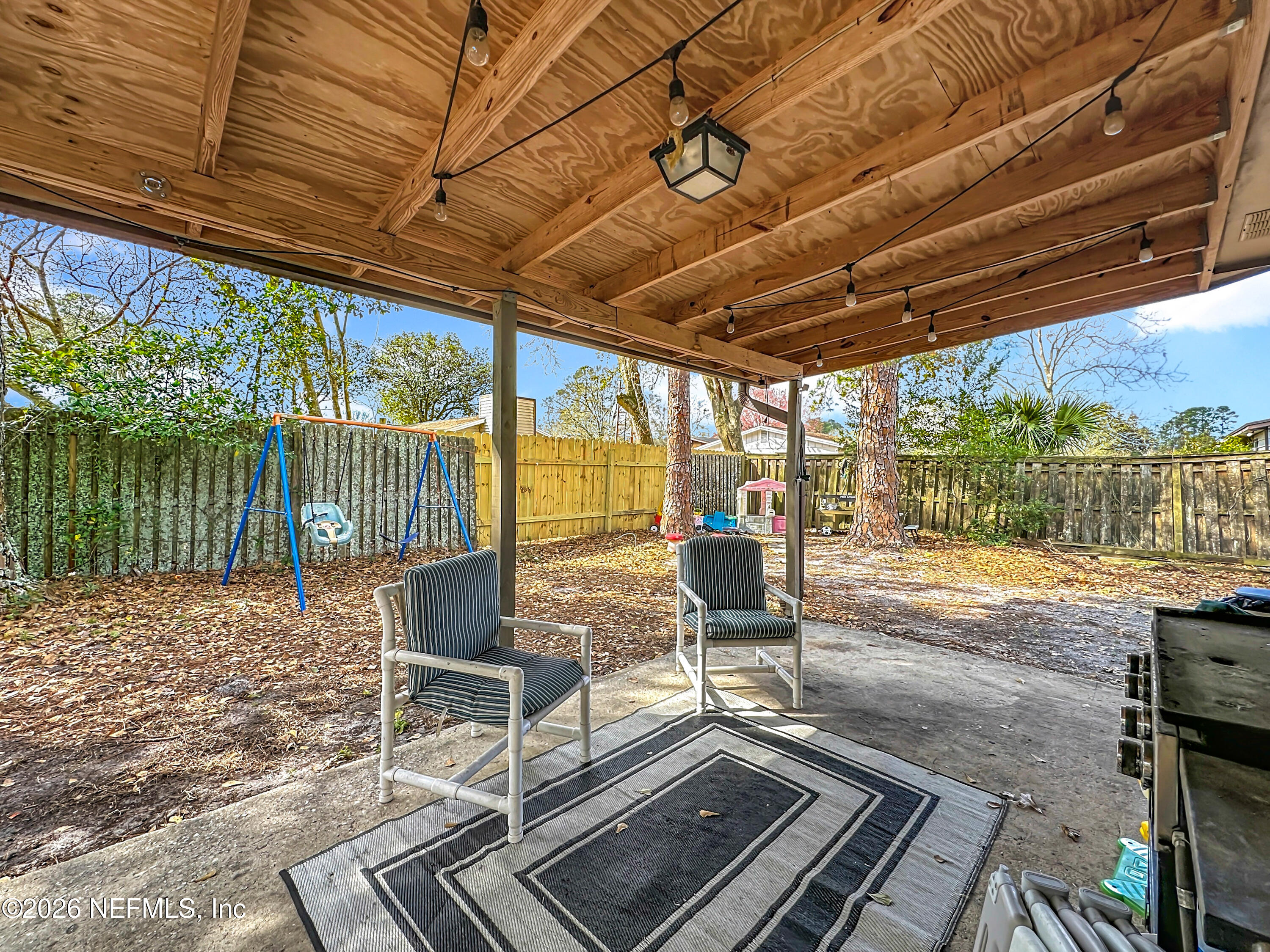 8302 Cassie Road Jacksonville, FL 32221 - Photo 41 of 48 a living room with a rug