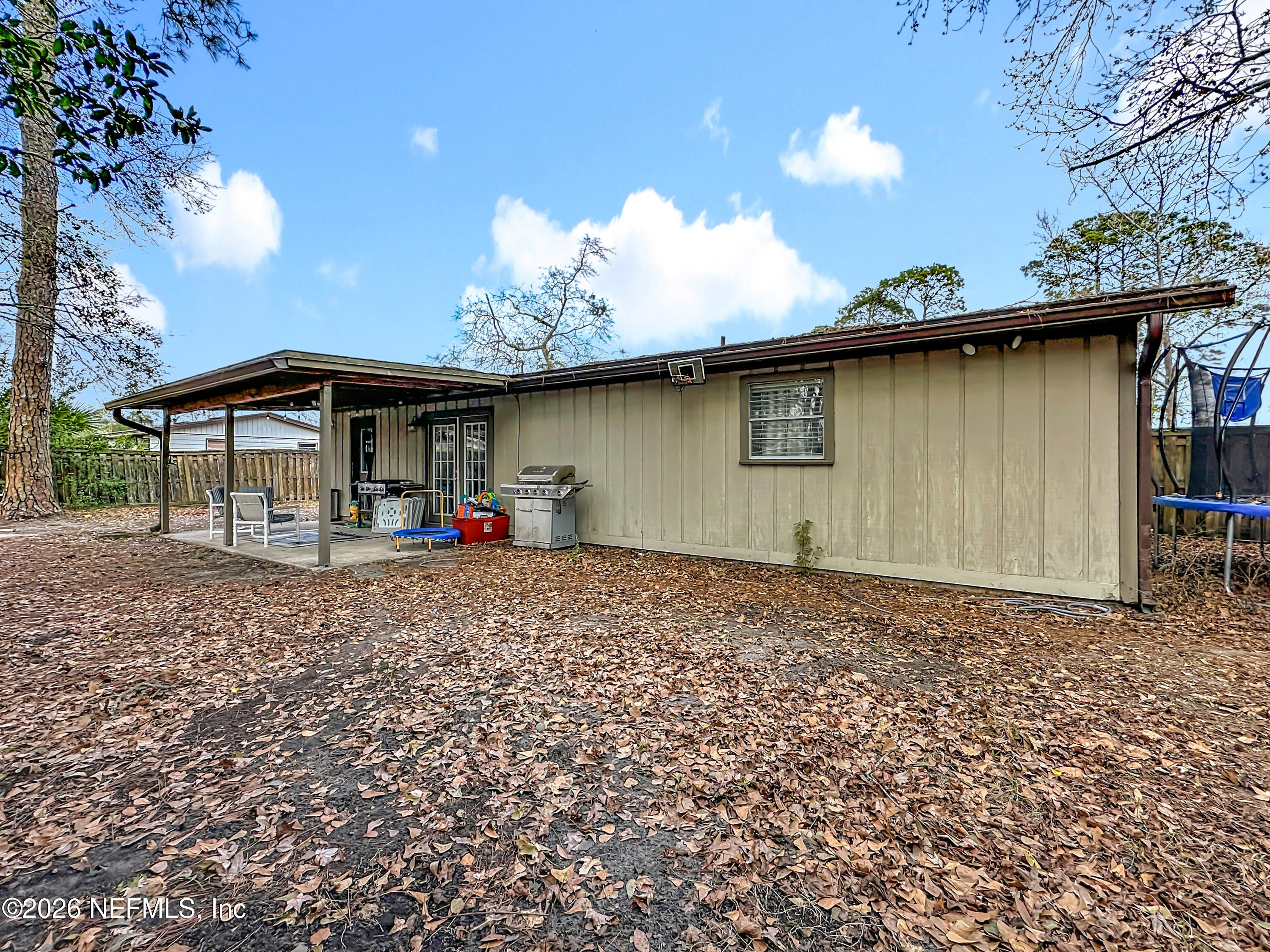 8302 Cassie Road Jacksonville, FL 32221 - Photo 42 of 46 a front view of a house with garden
