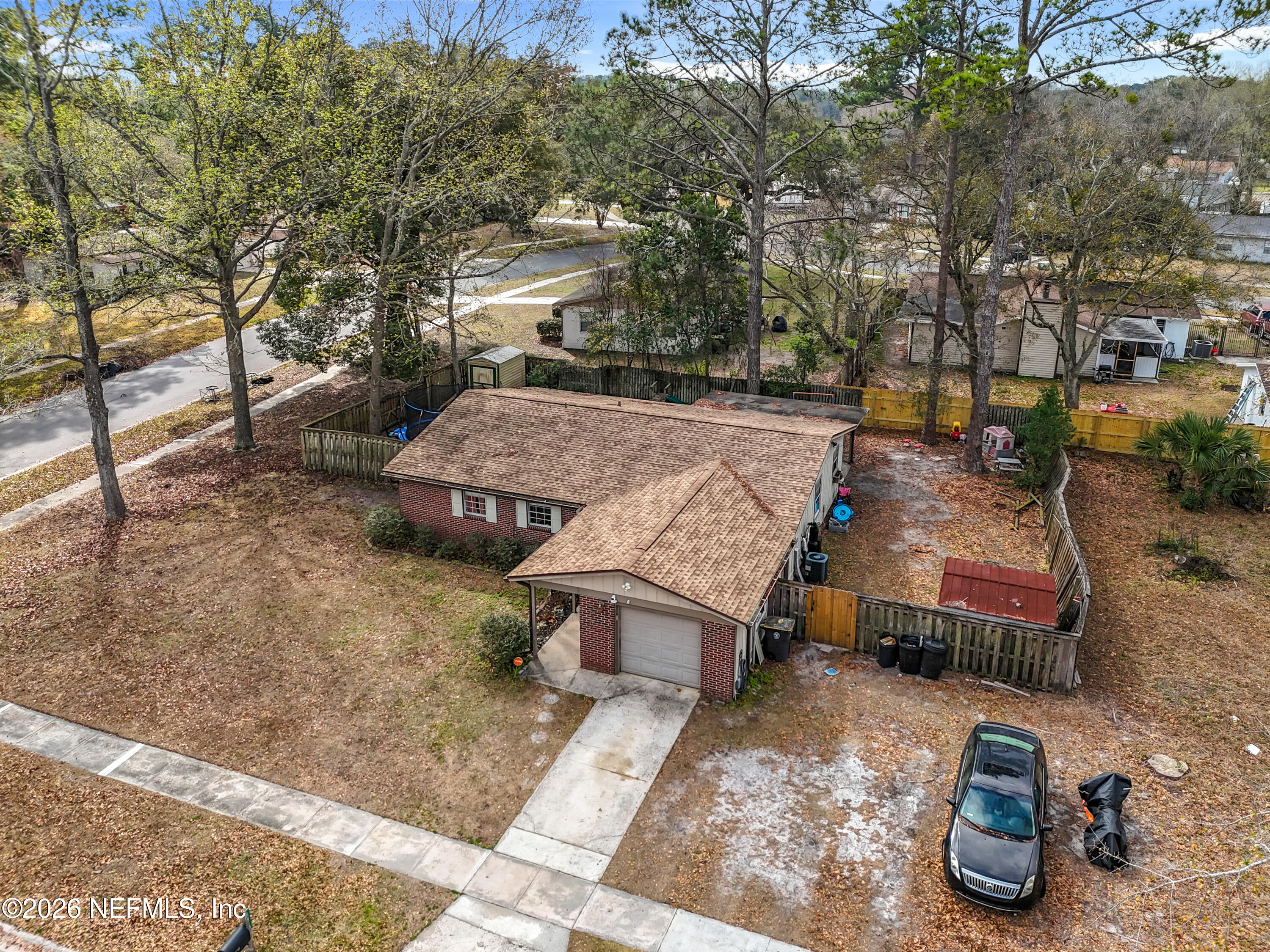 8302 Cassie Road Jacksonville, FL 32221 - Photo 45 of 48 an aerial view of a house with garden space and street view