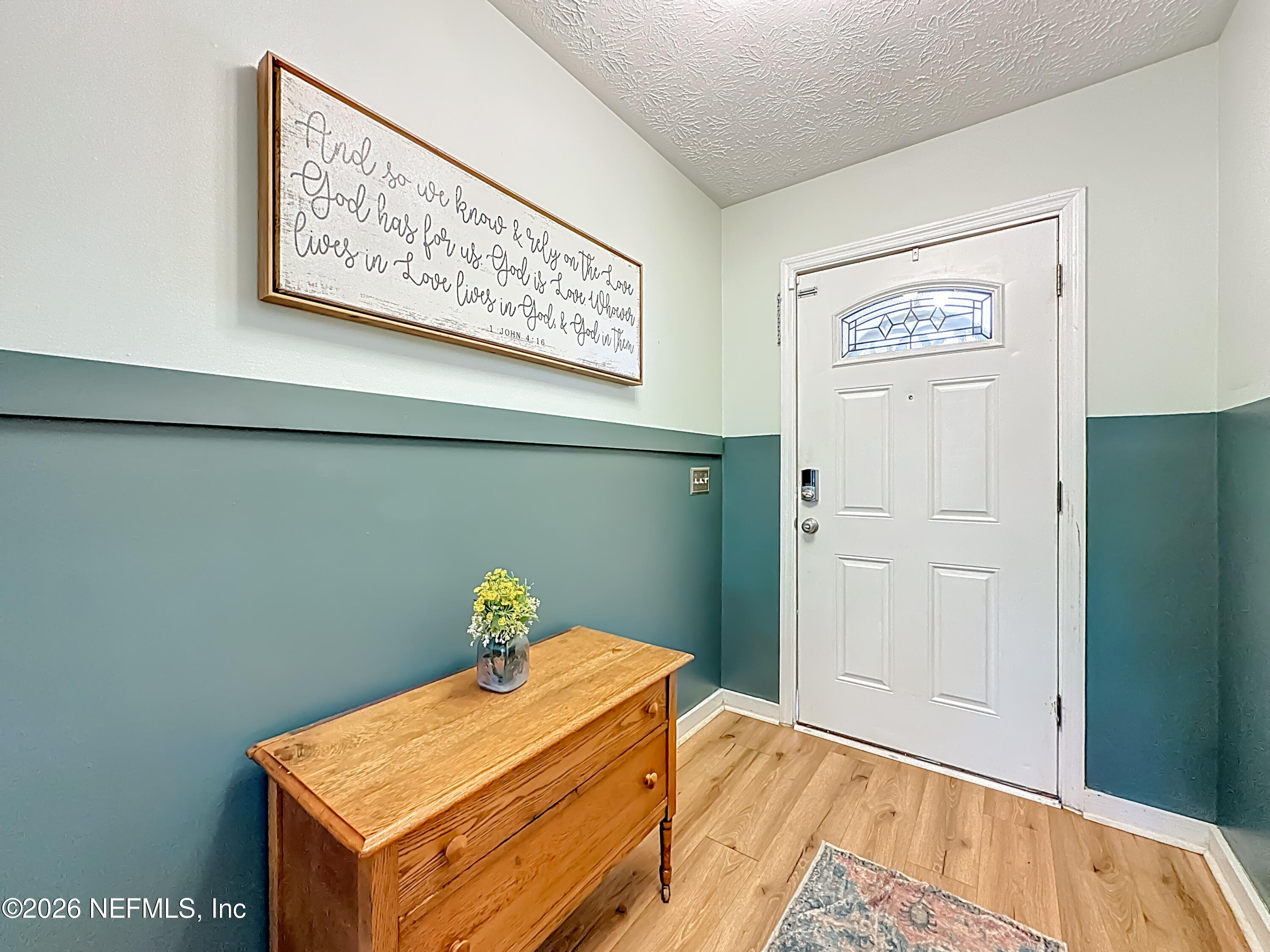 8302 Cassie Road Jacksonville, FL 32221 - Photo 9 of 48 a bedroom with a bed and painting on the wall