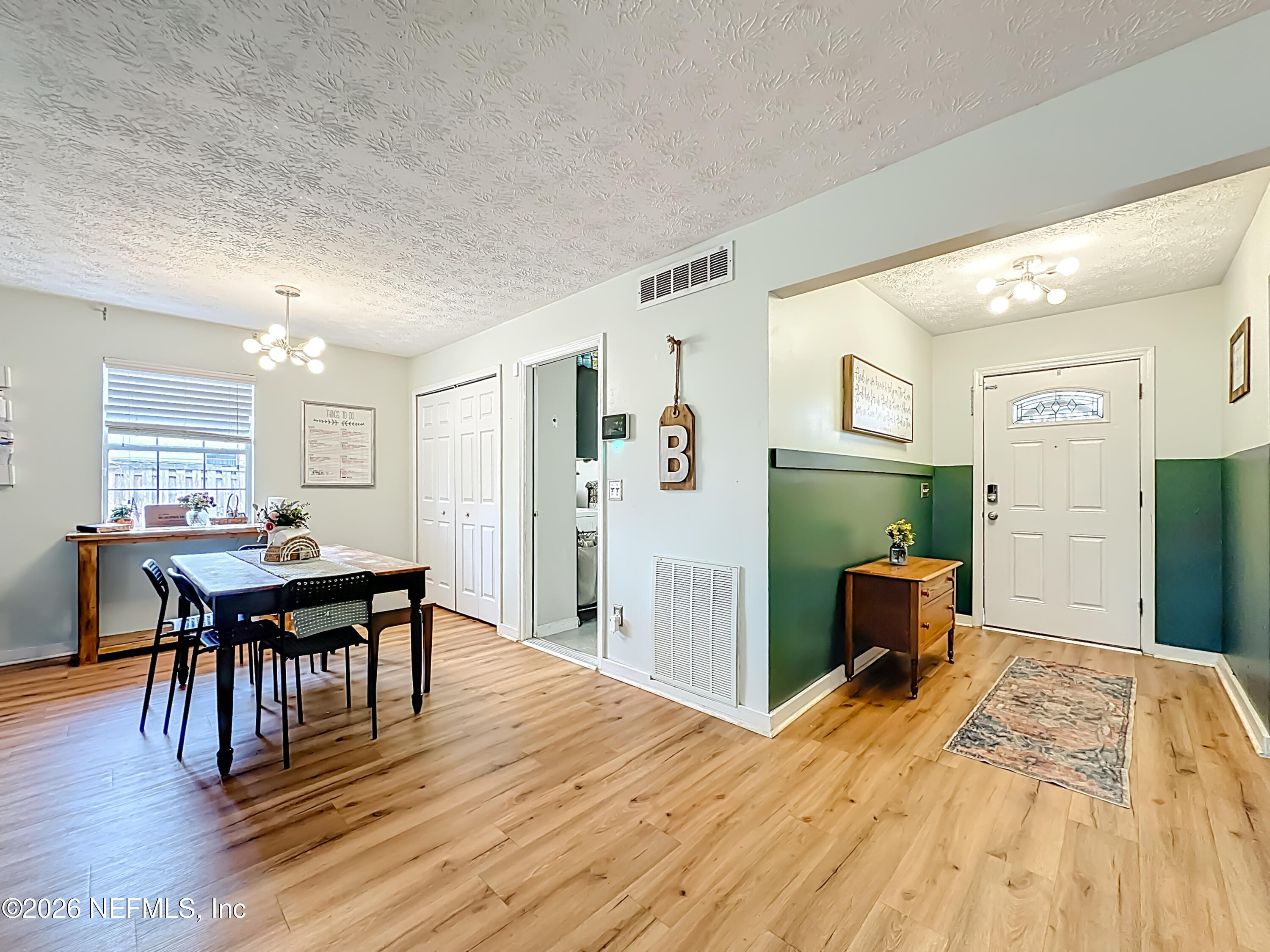 8302 Cassie Road Jacksonville, FL 32221 - Photo 10 of 48 a bedroom with a bed and a table