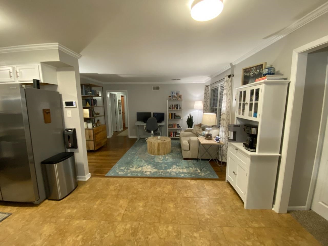 5068 Flamingo Road Memphis, TN 38117 - Photo 6 of 20 a living room with furniture and a refrigerator