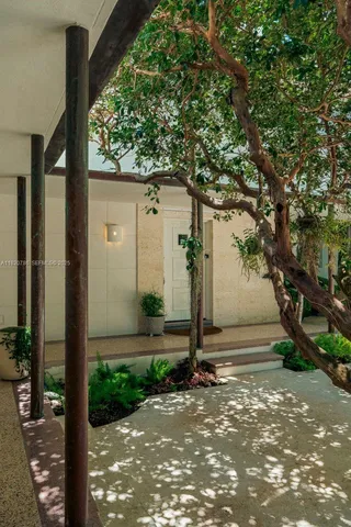 a kitchen with stainless steel appliances a stove a sink and a microwave