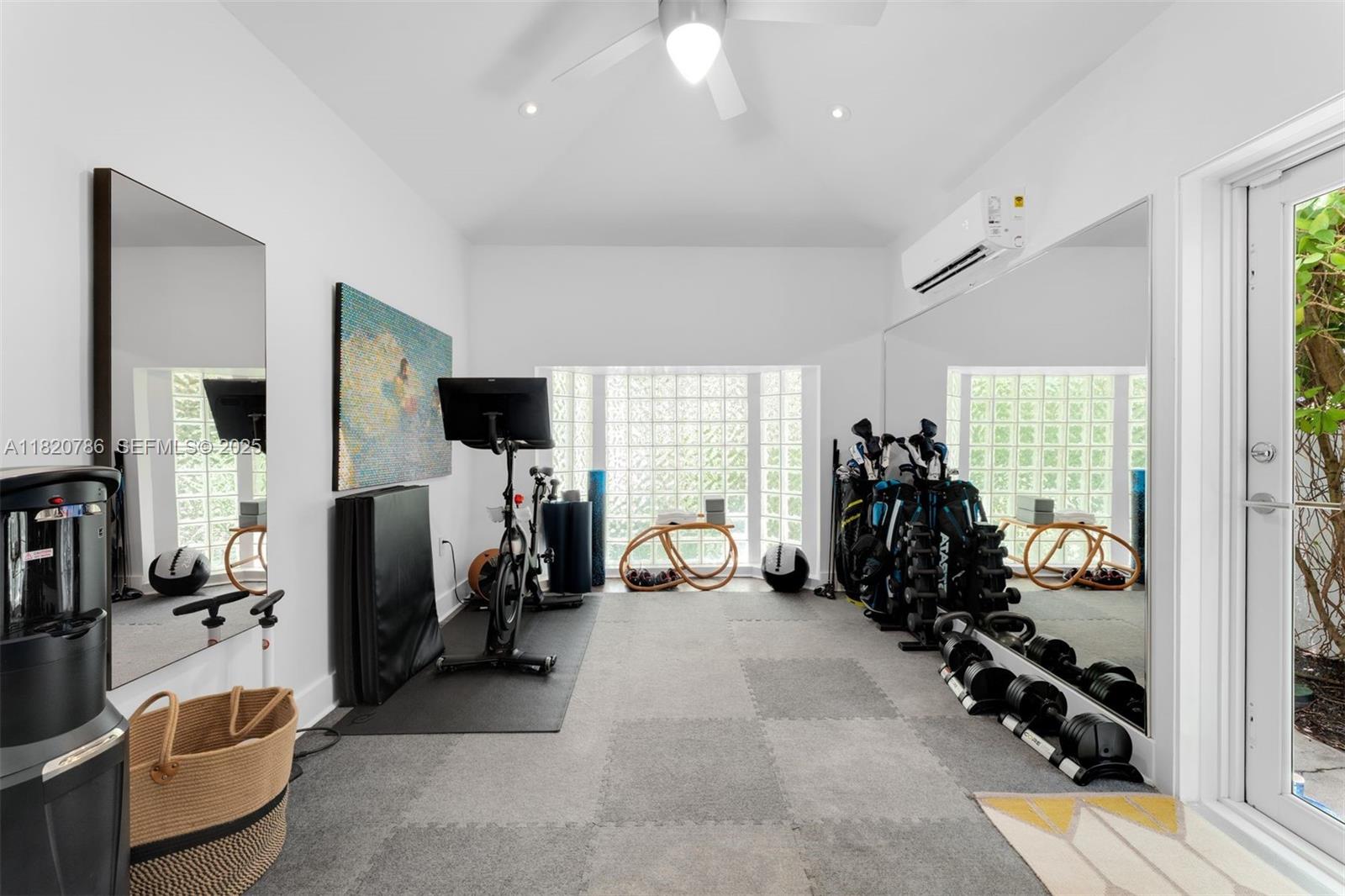 6165 Pine Tree Drive Miami Beach, FL 33140 - Photo 24 of 33 a view of a room with gym equipment