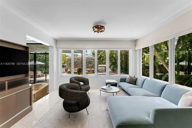 a view of a potted flower in front of a house