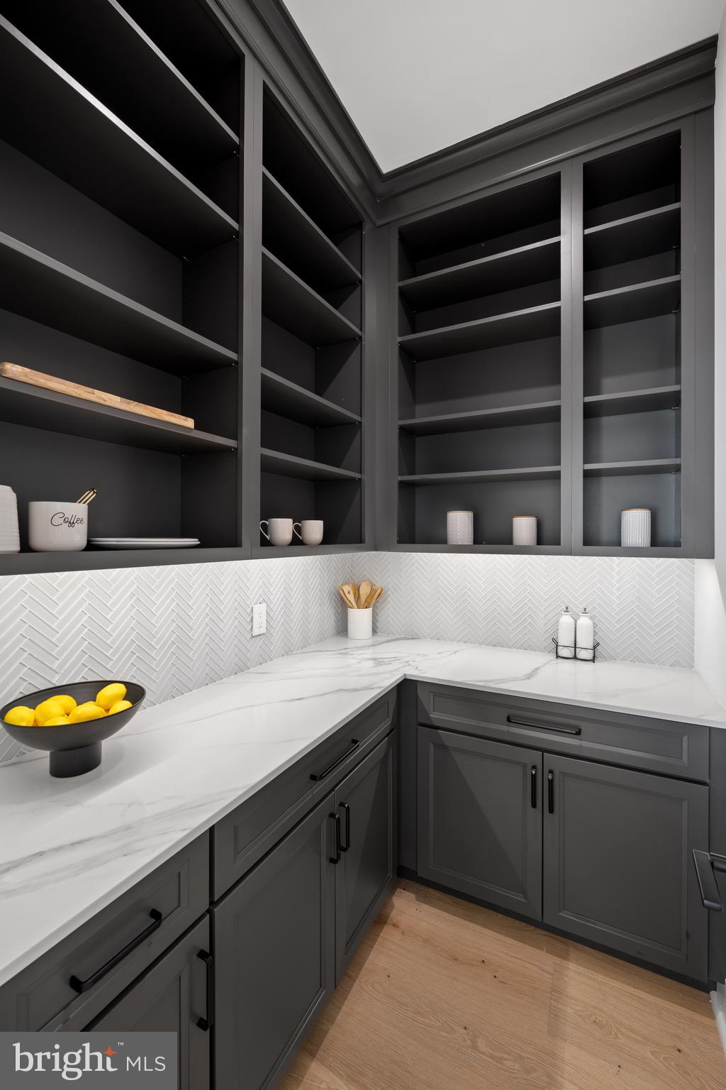761 Mt Moro Road Villanova, PA 19085 - Photo 25 of 92 Glass Herringbone backsplash and custom cabinets