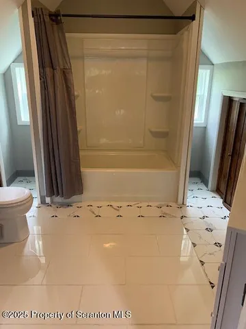 a view of staircase with black and white walls