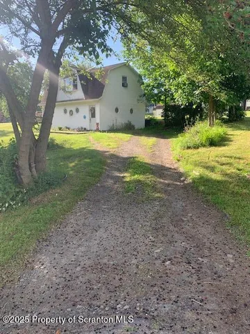 a view of a house with a big yard