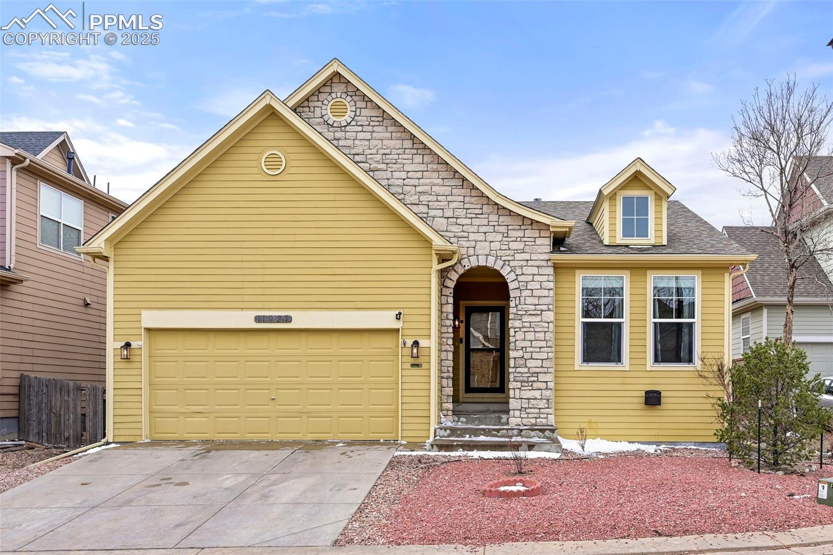 11927 Rodez Grove Peyton, CO 80831 - Photo 1 of 34 View of front of home featuring driveway, a shingled roof, and a garage