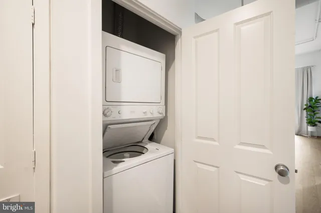a close view of a utility room with dryer and washer