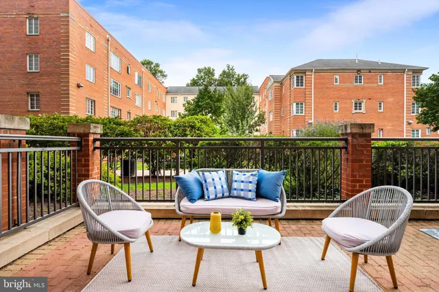 a view of a chairs and table in the patio