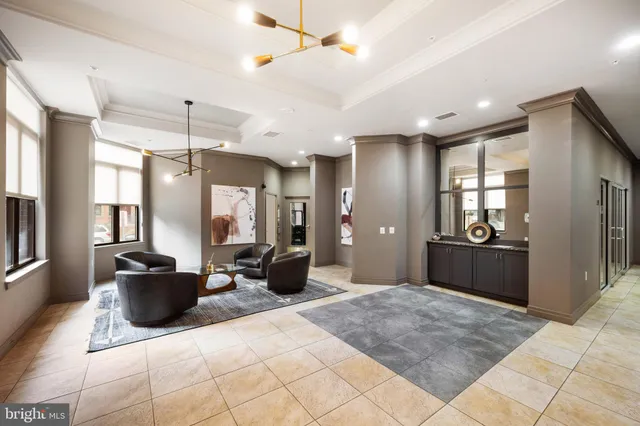 a lobby with furniture and window