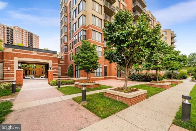 front view of a building with a garden