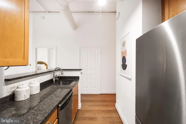a kitchen with granite countertop a sink and a granite counter tops