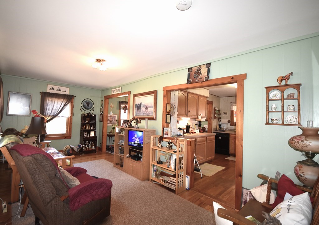 273 Snipatuit Road Rochester, MA 02770 - Photo 4 of 7 a view of a livingroom with furniture and a flat screen tv