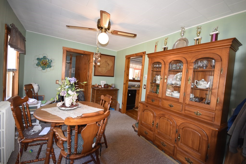 273 Snipatuit Road Rochester, MA 02770 - Photo 5 of 7 a view of a dining room with furniture window and wooden floor