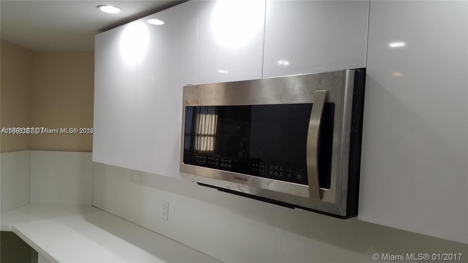 701 Brickell Key Boulevard, Unit 2412 Miami, FL 33131 - Photo 5 of 10 a room with a fireplace
