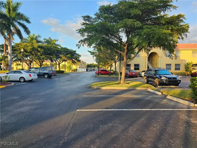 a view of yard with swimming pool and trees