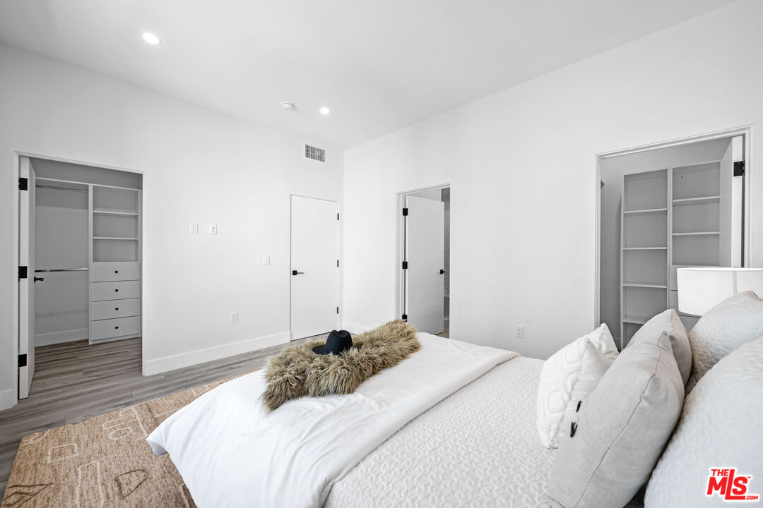 1959 Preuss Road Los Angeles, CA 90034 - Photo 13 of 29 a bedroom with a bed and a walk in closet