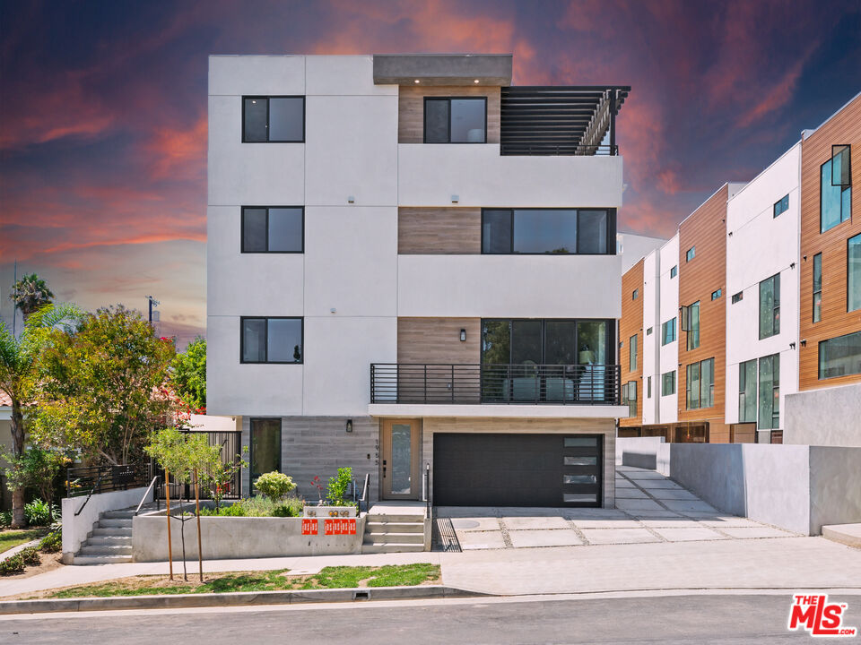 1959 Preuss Road Los Angeles, CA 90034 - Photo 2 of 29 a front view of a multi story building with yard