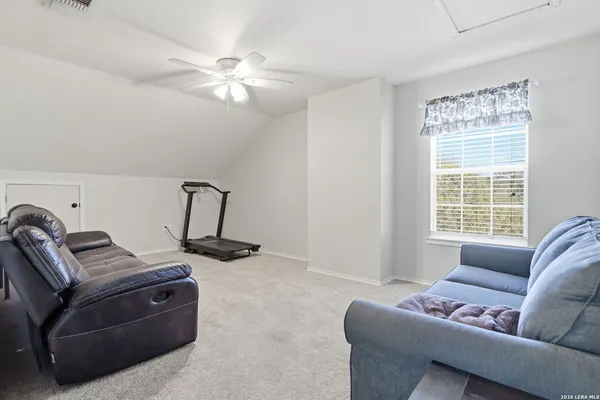 a living room with furniture and window