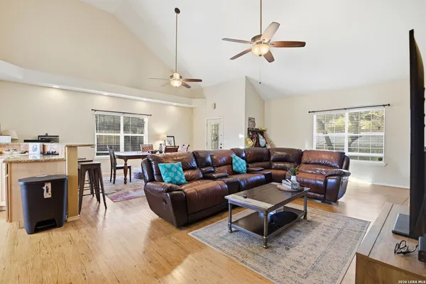 a living room with furniture a fireplace and a window