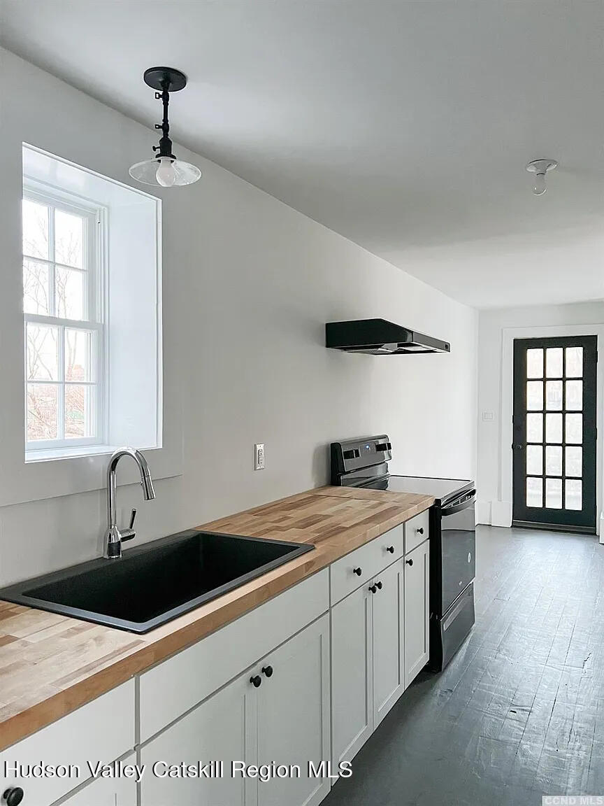 30 Union Street, Unit 2 Hudson, NY 12534 - Photo 7 of 10 a kitchen with a sink and cabinets