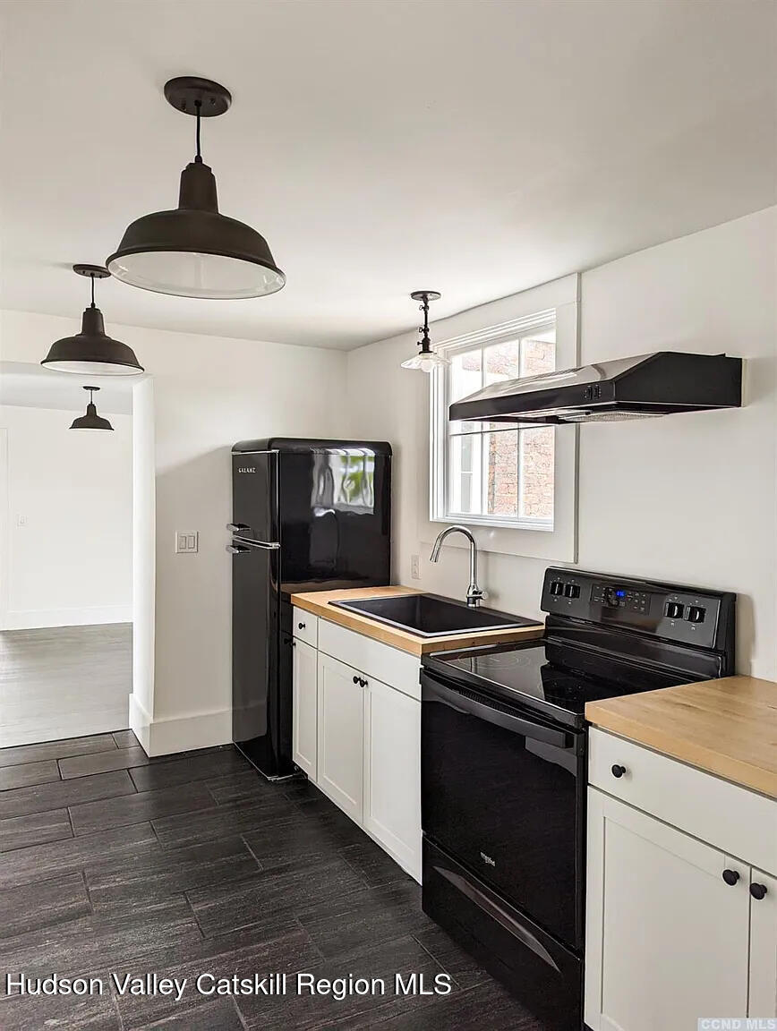 30 Union Street, Unit 2 Hudson, NY 12534 - Photo 8 of 10 a kitchen with a sink cabinets and window