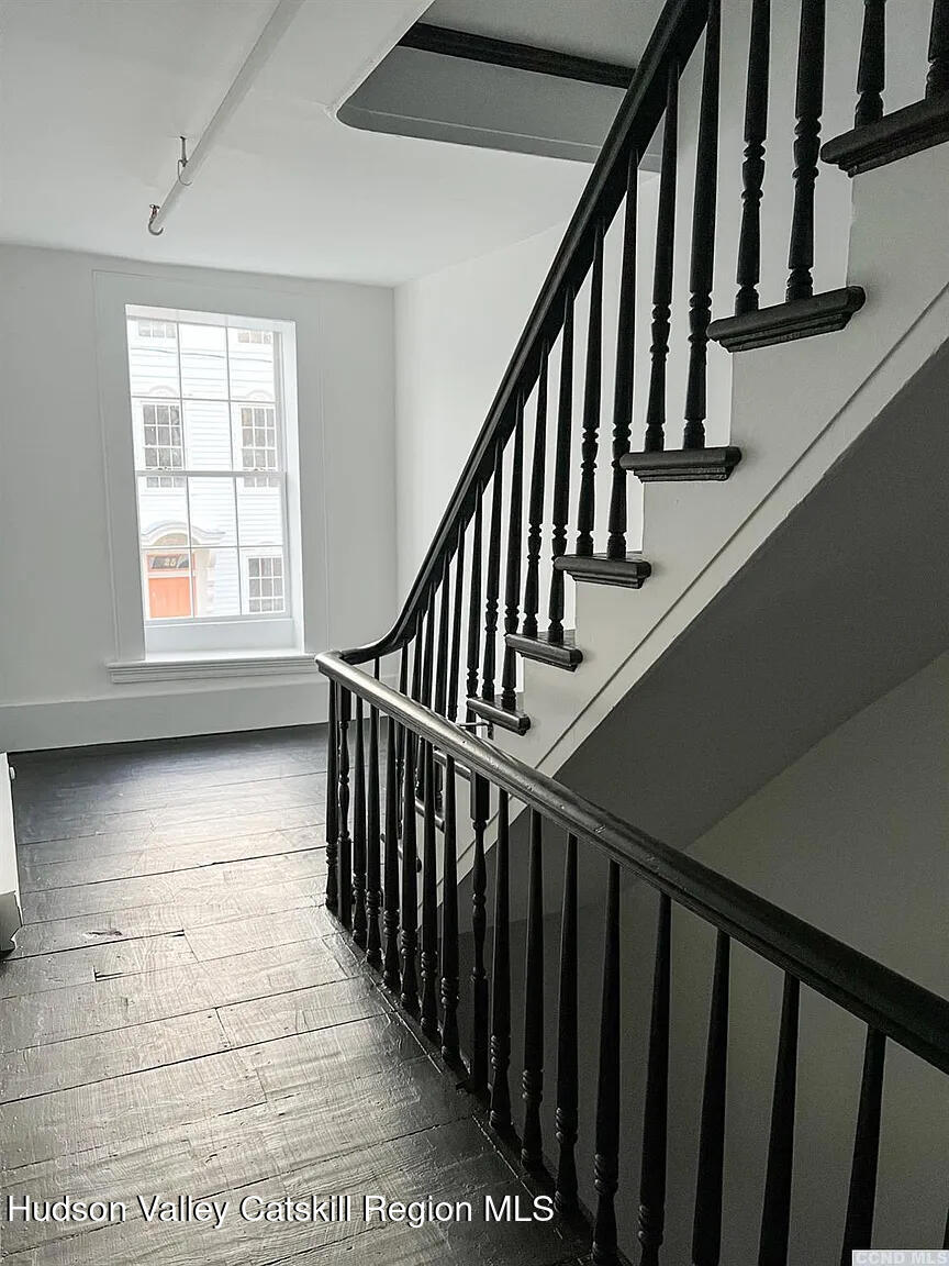 30 Union Street, Unit 2 Hudson, NY 12534 - Photo 9 of 10 a view of staircase with lots of windows and white walls