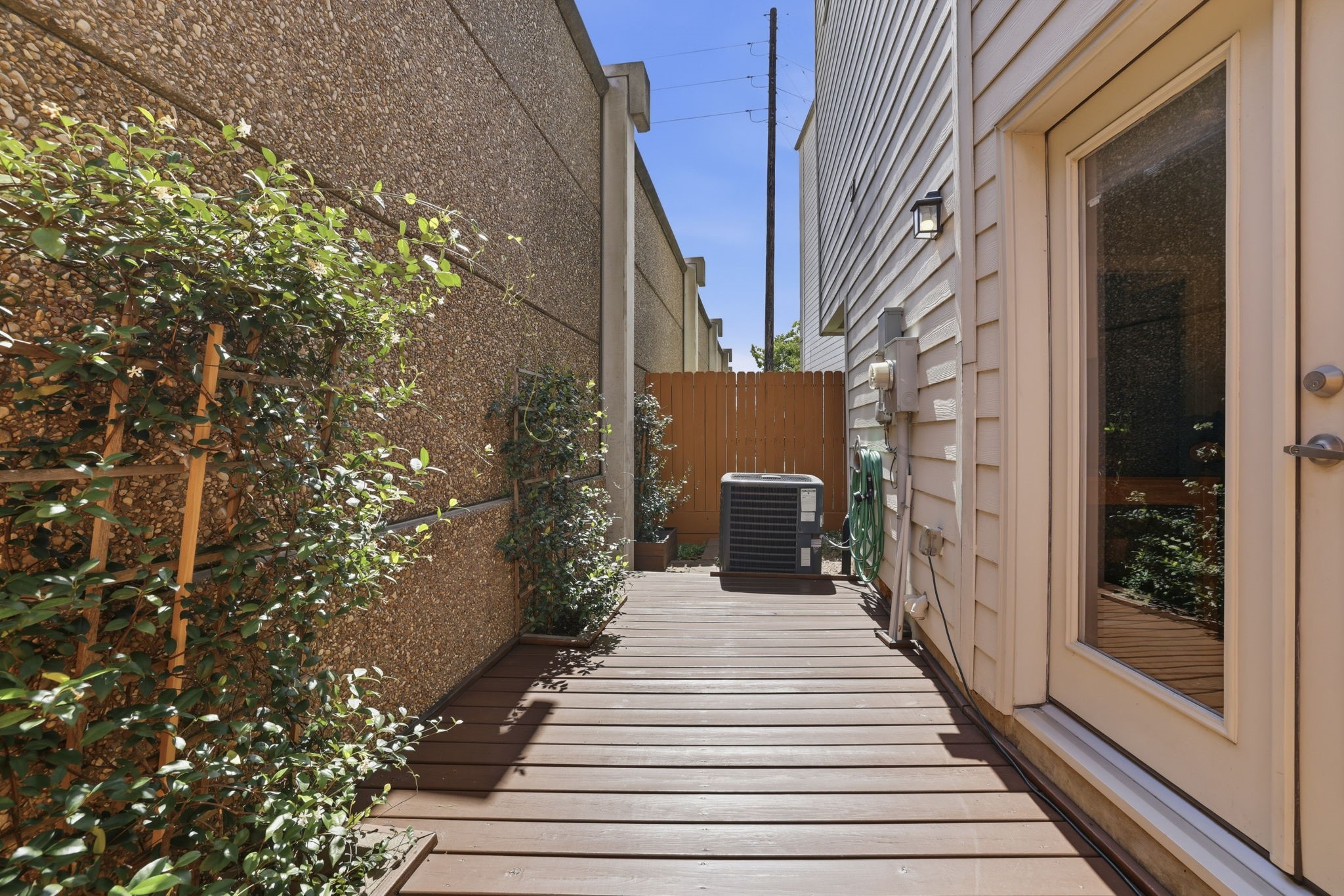 4102 Marina Street Houston, TX 77007 - Photo 6 of 32 The private, first-floor patio features a spacious deck made for soaking up the sun, complemented by a dedicated patch of grass—the ultimate urban retreat for you and your four-legged friend(s).