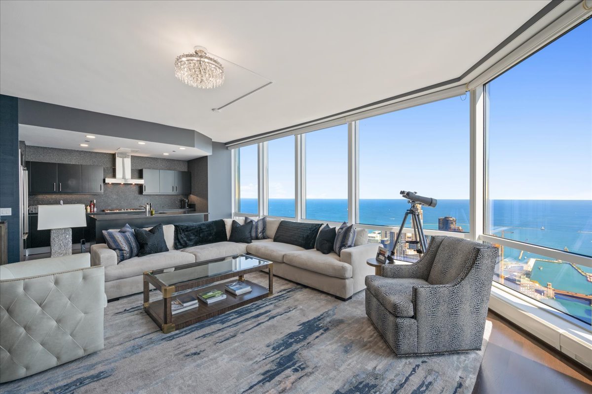 401 North Wabash Avenue, Unit 73F Chicago, IL 60611 - Photo 3 of 40 a living room with furniture and a large window