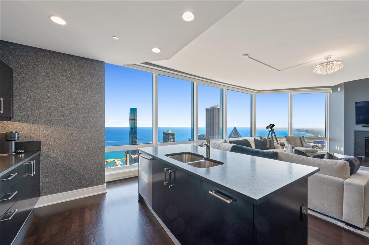 401 North Wabash Avenue, Unit 73F Chicago, IL 60611 - Photo 5 of 40 a kitchen with sink refrigerator and cabinets