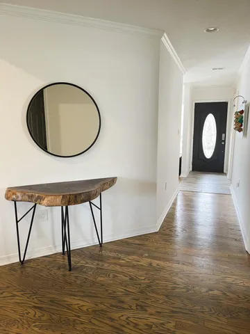 a view of a livingroom with furniture and wooden floor