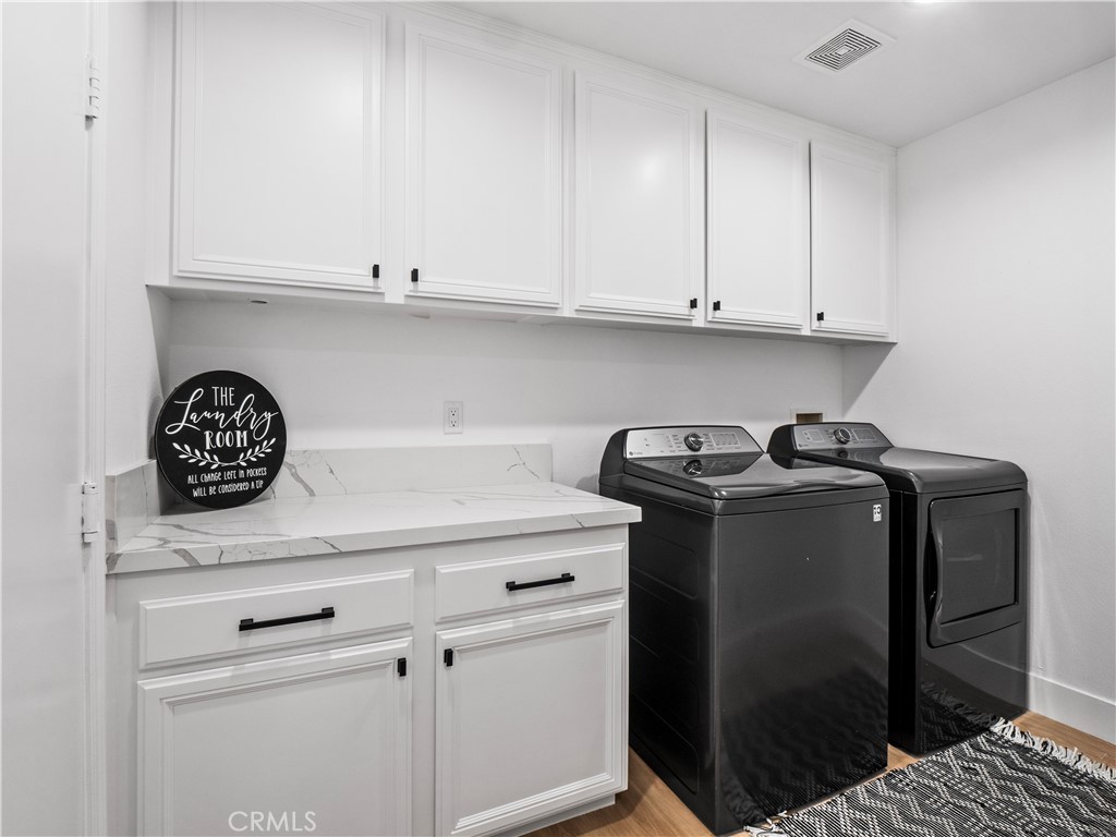 29461 Sequoia Road Canyon Country, CA 91387 - Photo 15 of 51 a utility room with dryer and washer