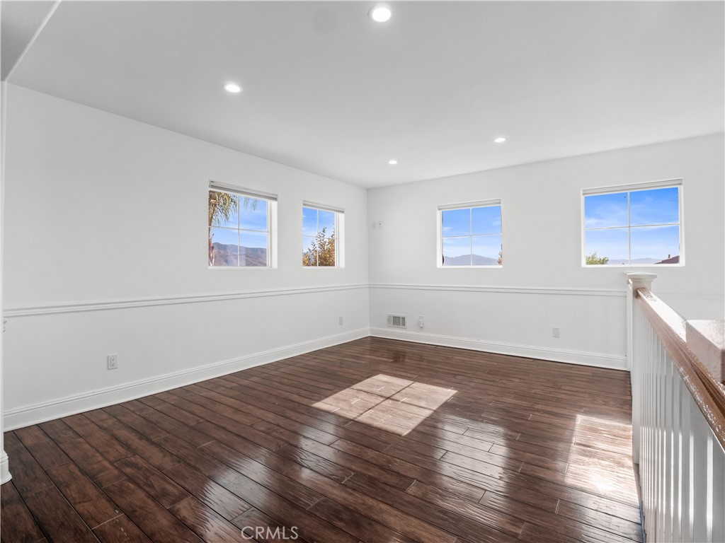 29461 Sequoia Road Canyon Country, CA 91387 - Photo 17 of 51 a view of a room with wooden floor and window