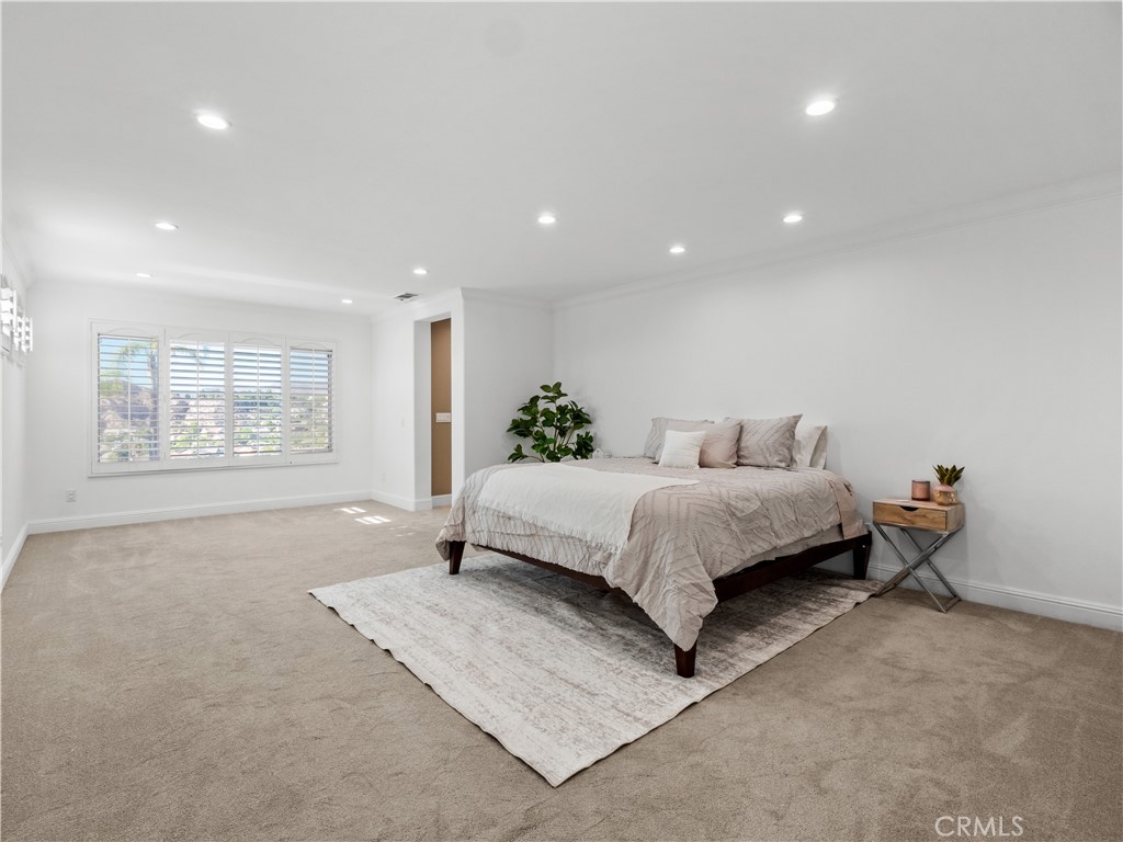 29461 Sequoia Road Canyon Country, CA 91387 - Photo 21 of 51 a spacious bedroom with a bed and window