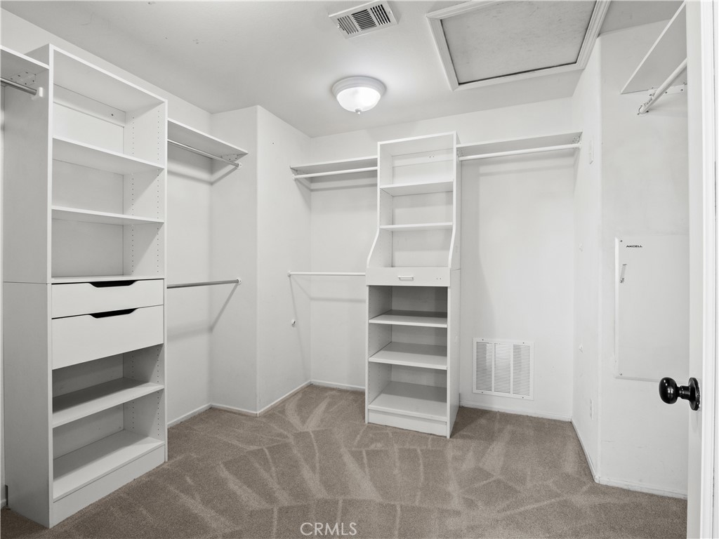 29461 Sequoia Road Canyon Country, CA 91387 - Photo 24 of 51 a view of walk in closet with empty racks