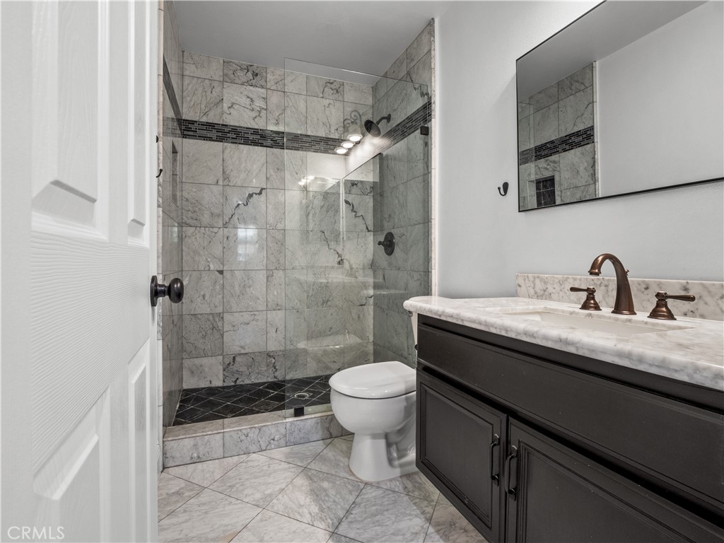 29461 Sequoia Road Canyon Country, CA 91387 - Photo 26 of 51 a bathroom with a sink toilet and shower