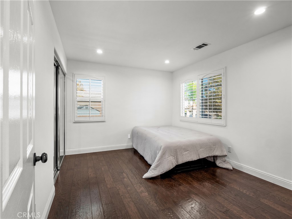 29461 Sequoia Road Canyon Country, CA 91387 - Photo 28 of 51 a spacious bedroom with a bed and a window