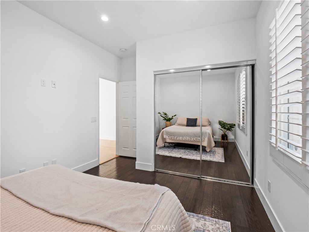 29461 Sequoia Road Canyon Country, CA 91387 - Photo 5 of 51 a bedroom with a bed and a walk in closet