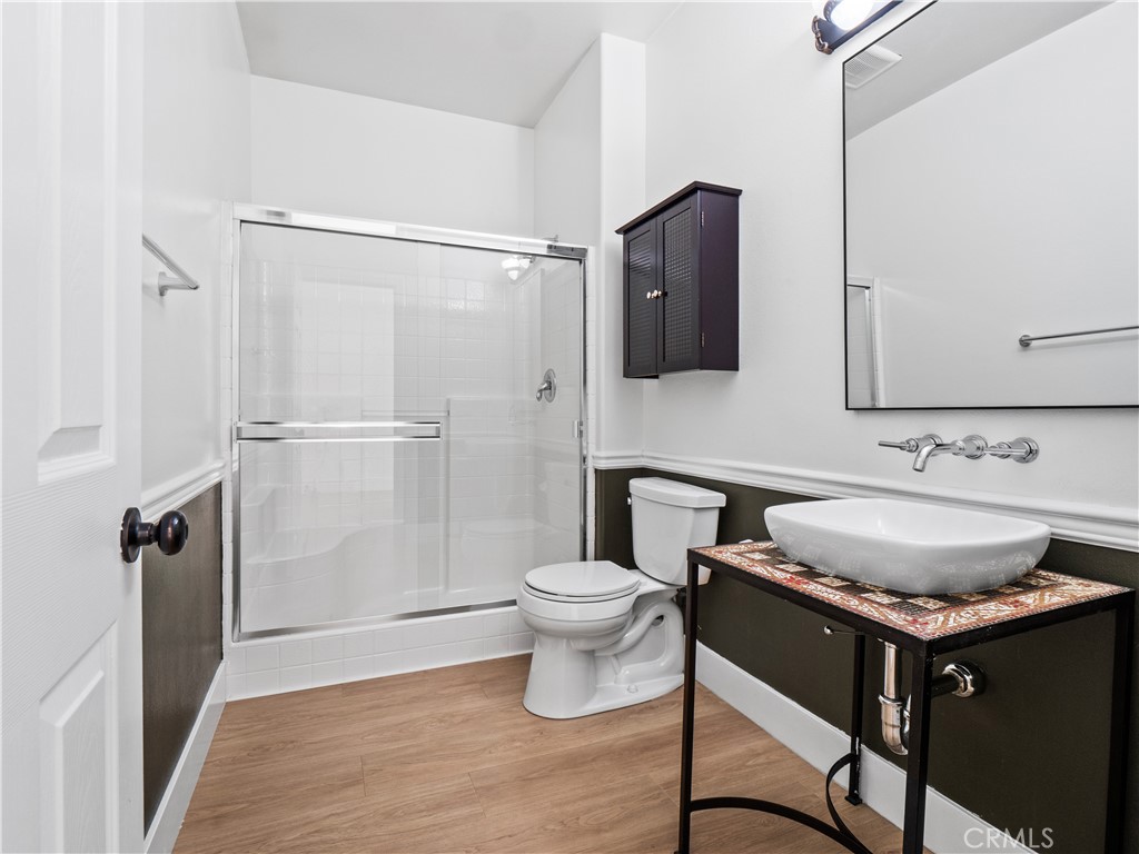 29461 Sequoia Road Canyon Country, CA 91387 - Photo 6 of 51 a bathroom with a granite countertop sink toilet and shower