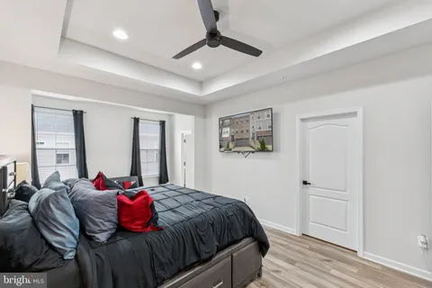 a bed room with a bed and a chandelier