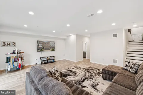 a living room with furniture and a rug