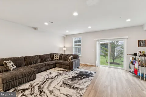 a living room with furniture window and couch