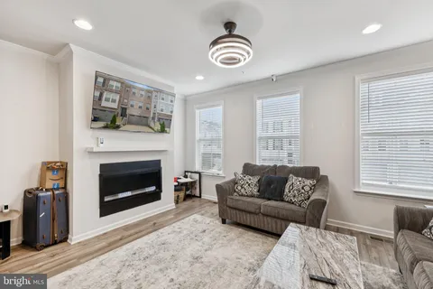 a living room with furniture a window and a fireplace